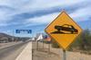 Yellow speed bump sign